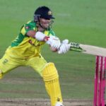Australia's batsman David Warner stretches to play a shot during the international Twenty20 cricket match between England and Australia.