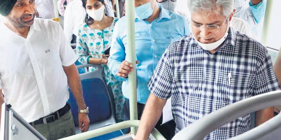 Transport Minister Kailash Gahlot inspects buses being fitted with CCTV, panic buttons & GPS.
