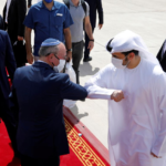 Israeli national security adviser Meir Ben-Shabbat bumps elbows with an Emirati official as he makes his way to board a plane to leave Abu Dhabi, United Arab Emirates, on Sept. 1.