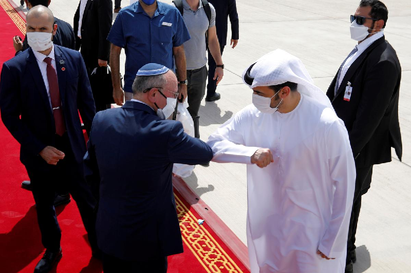 Israeli national security adviser Meir Ben-Shabbat bumps elbows with an Emirati official as he makes his way to board a plane to leave Abu Dhabi, United Arab Emirates, on Sept. 1.