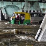 ehicles ply on the waterlogged Bahadur Shah Zafar Marg after heavy rain at ITO in New Delhi on Wednesday.