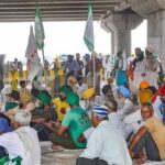 Farmers block the Sonipat-Panipat road during their 'Bharat Bandh' against central government's three farm reform laws.