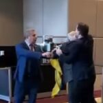 Russian Official Snatches Flag, Ukraine MP Whacks Him