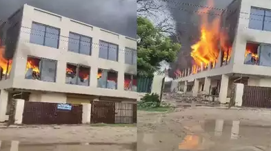 26 fire engines on site battling a large fire at a garment factory in Delhi, with no reported injuries.