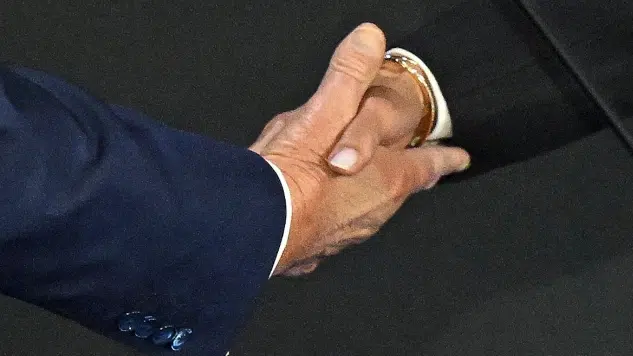Kamala Harris and Donald Trump shake hands on stage before the 2024 presidential debate, showing a rare moment of civility.