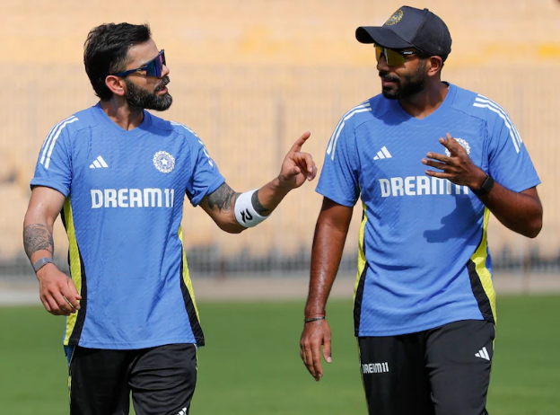 Indian cricket players celebrating after a competitive fielding drill during a practice session in Chennai.