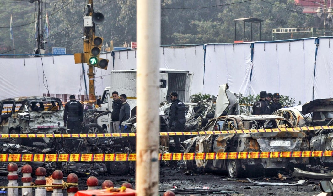 Explosion site near Delhi’s Red Fort metro station following the deadly car blast on November 10, 2025; security personnel and emergency responders are present.