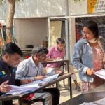 Civil servants verifying voter details as part of India’s nationwide voter list update drive