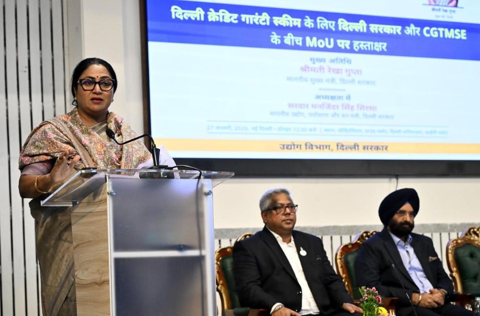Delhi Chief Minister Rekha Gupta speaking at the Delhi Secretariat during the loan scheme agreement signing.