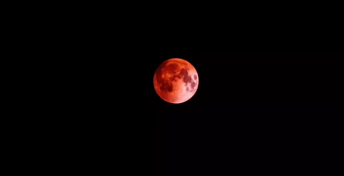 Blood Moon during total lunar eclipse on March 3, 2026, glowing red-orange in the night sky